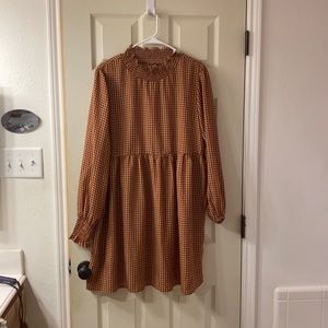Adorable maroon and gold long sleeved dress.